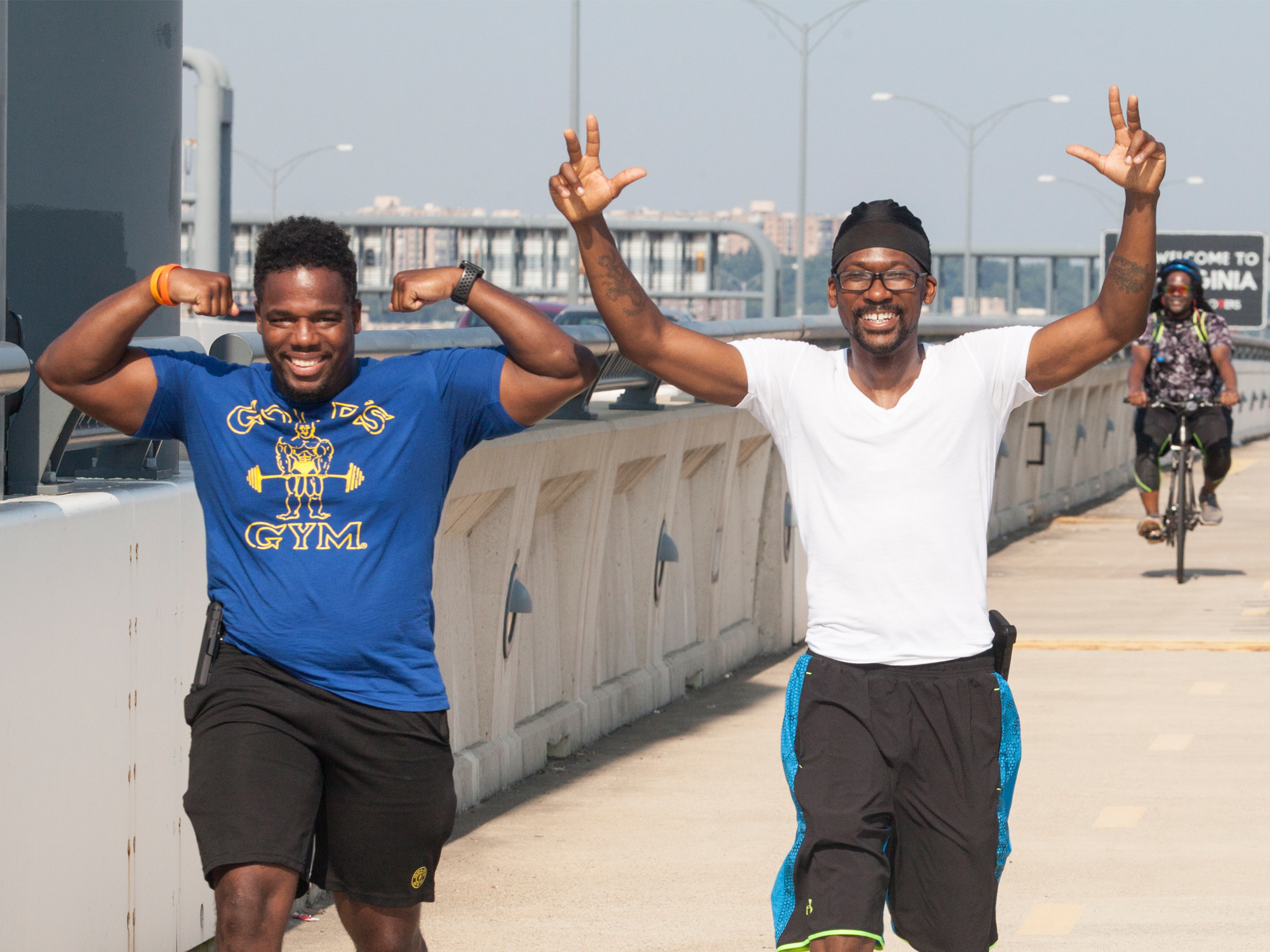 Men Walking in Celebration on Wilson Bridge